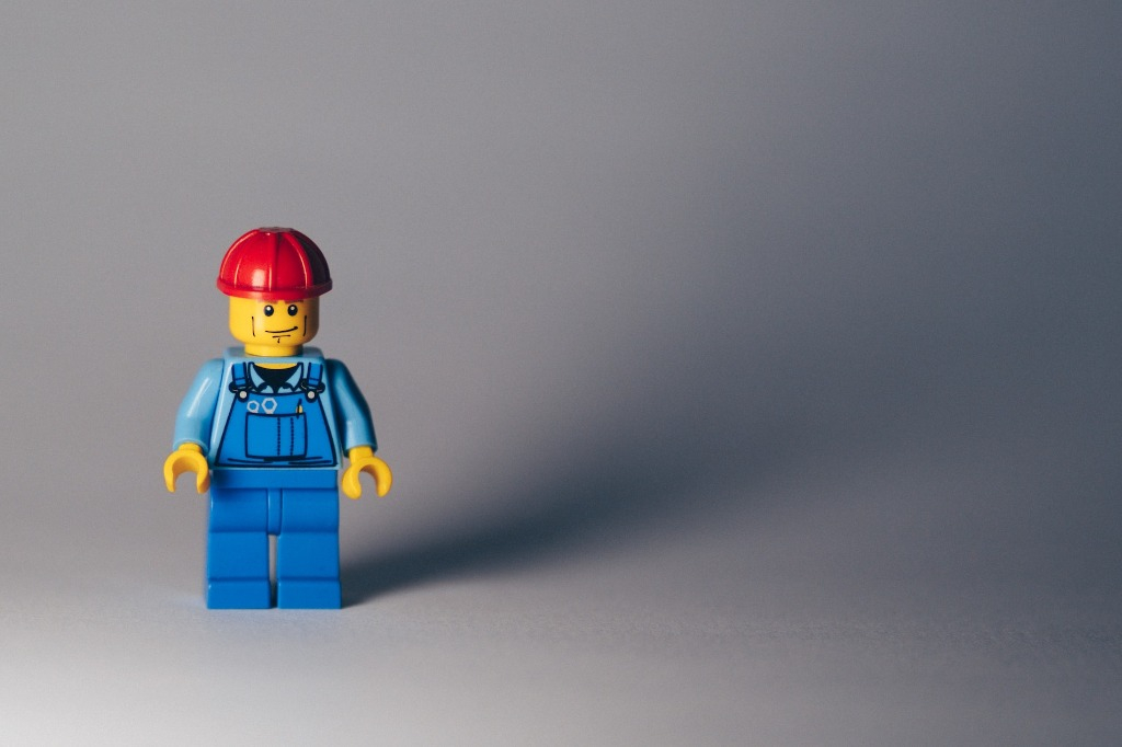 A Lego person dressed as a builder