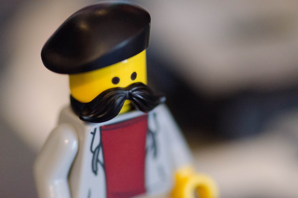 A lego person dressed as an artist