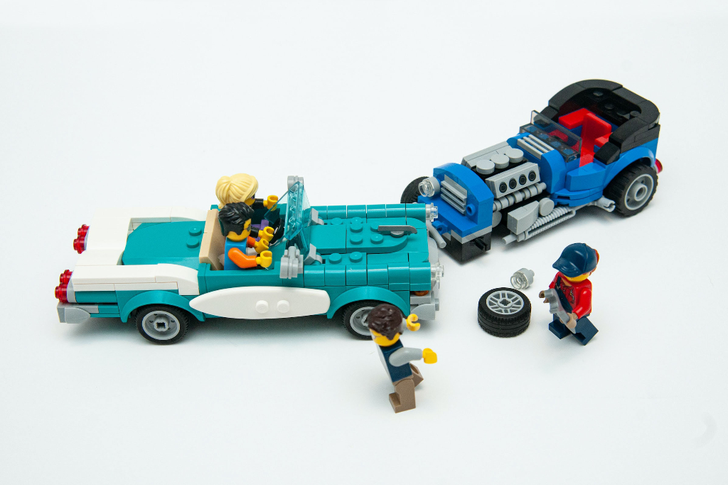 A complete Lego car and smaller broken one